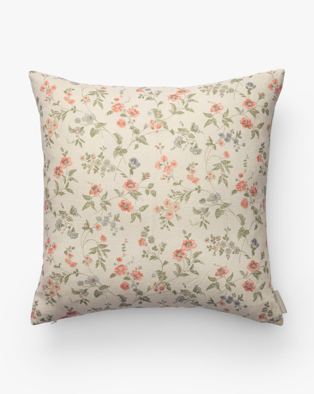 The Kittredge Floral Pillow Cover features a cream background with a ditsy floral pattern in pink, orange, and blue with green leaves, bringing simple, vintage-inspired elegance to any space, by McGee & Co.