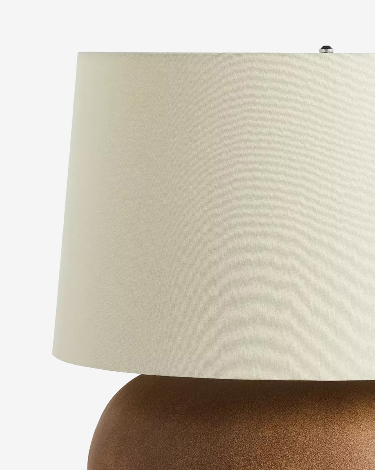 A close-up of the Kragen Table Lamp, featuring a large ivory linen shade atop a rounded brown ceramic base, displayed against a plain white background, by McGee & Co.