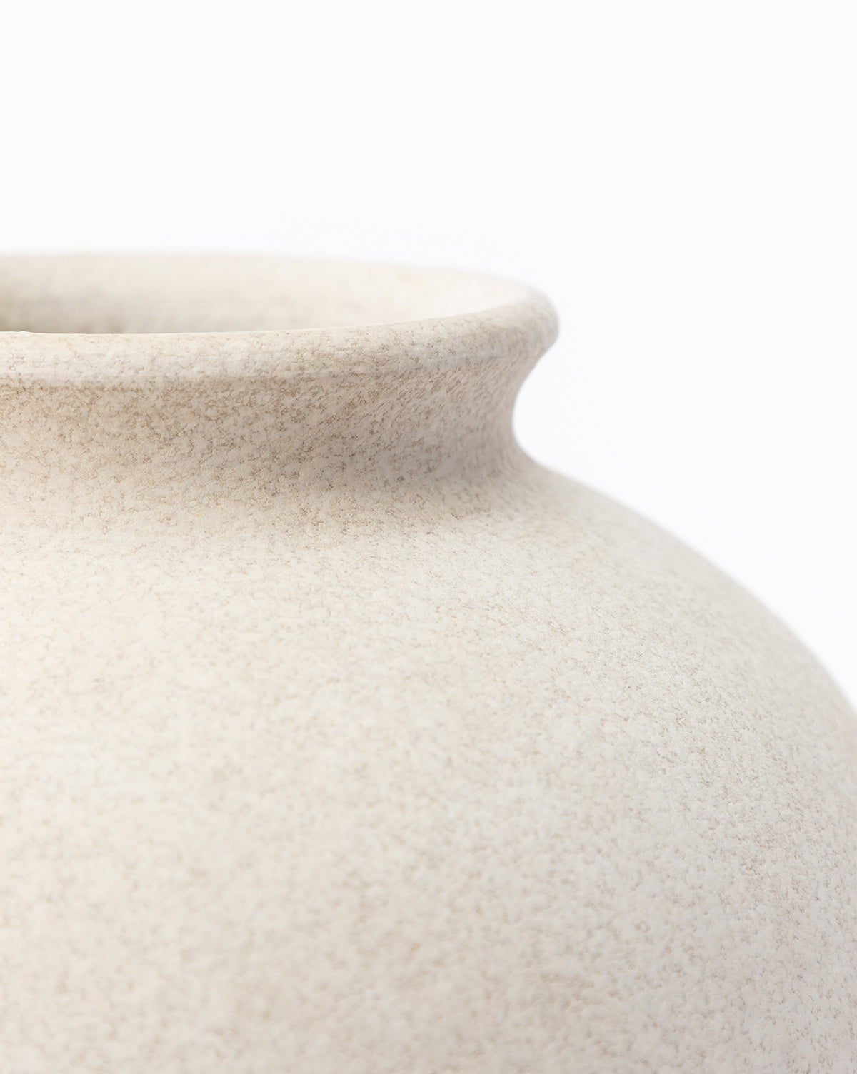 Close-up of the rim and upper body of the Krissan Vase, highlighted by its pebbled white finish, set against a plain white background, by McGee & Co.