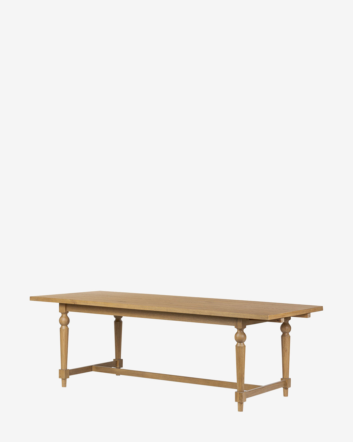 The Kyler Oak Extension Dining Table features a rectangular Scandinavian modern design with a smooth top and four turned legs joined by a horizontal support beam, shown against a plain white background, by McGee & Co.