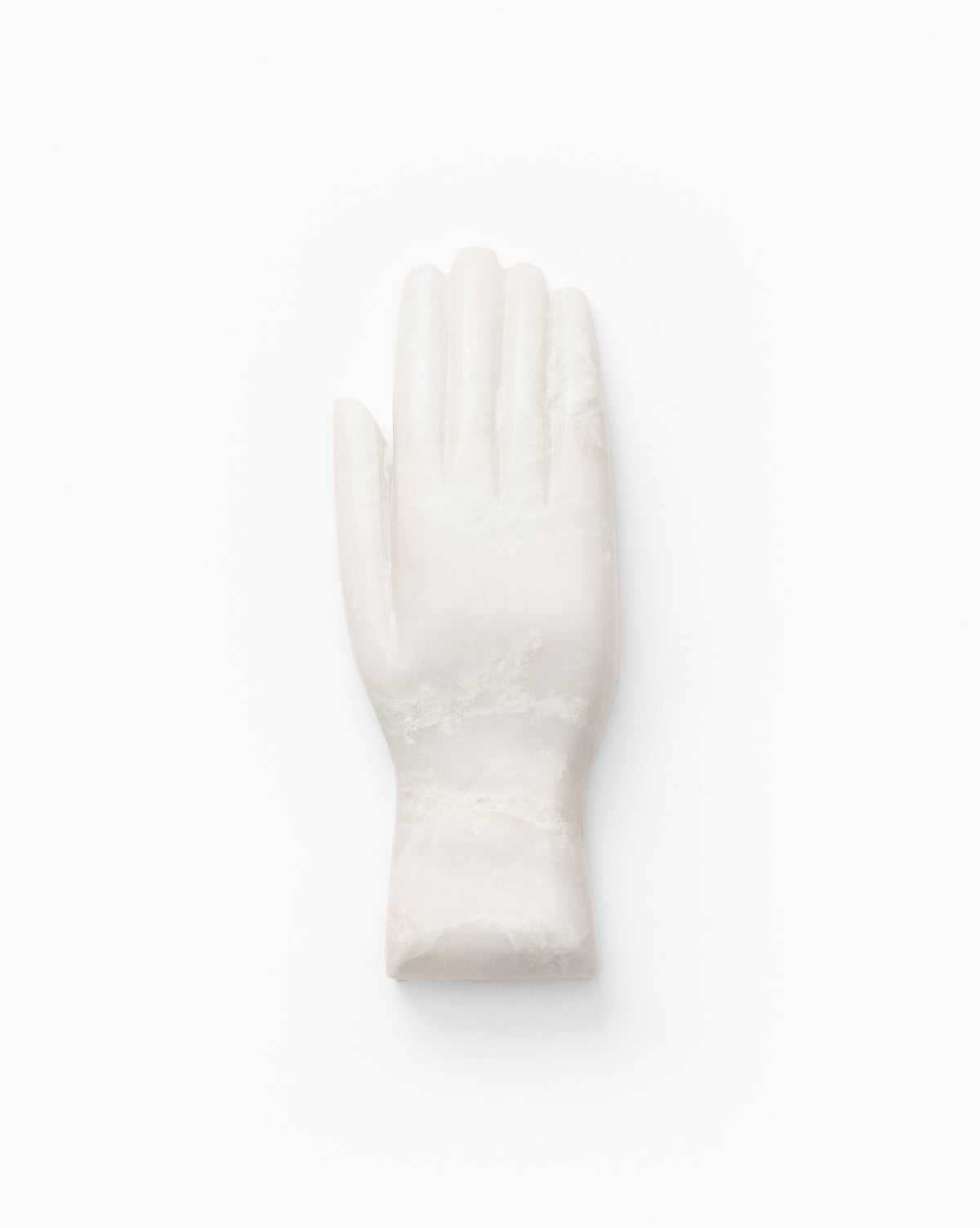 The Lady Onyx Hand Object is a smooth white marble sculpture with fingers together and palm facing forward, its wrist cut flat—making it a striking decorative piece ideal for contemporary spaces.