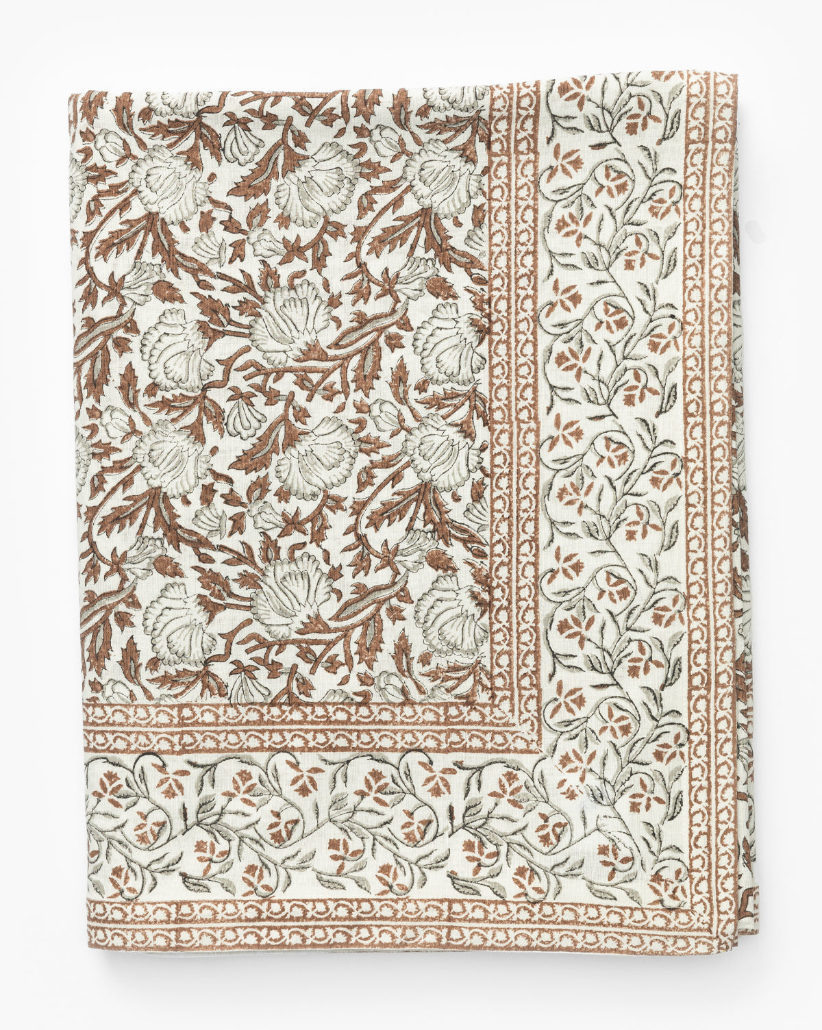 The Lannister Block Print Tablecloth is a folded cotton-linen piece featuring an intricate brown and gray floral pattern on an off-white background with a decorative border design by McGee & Co.