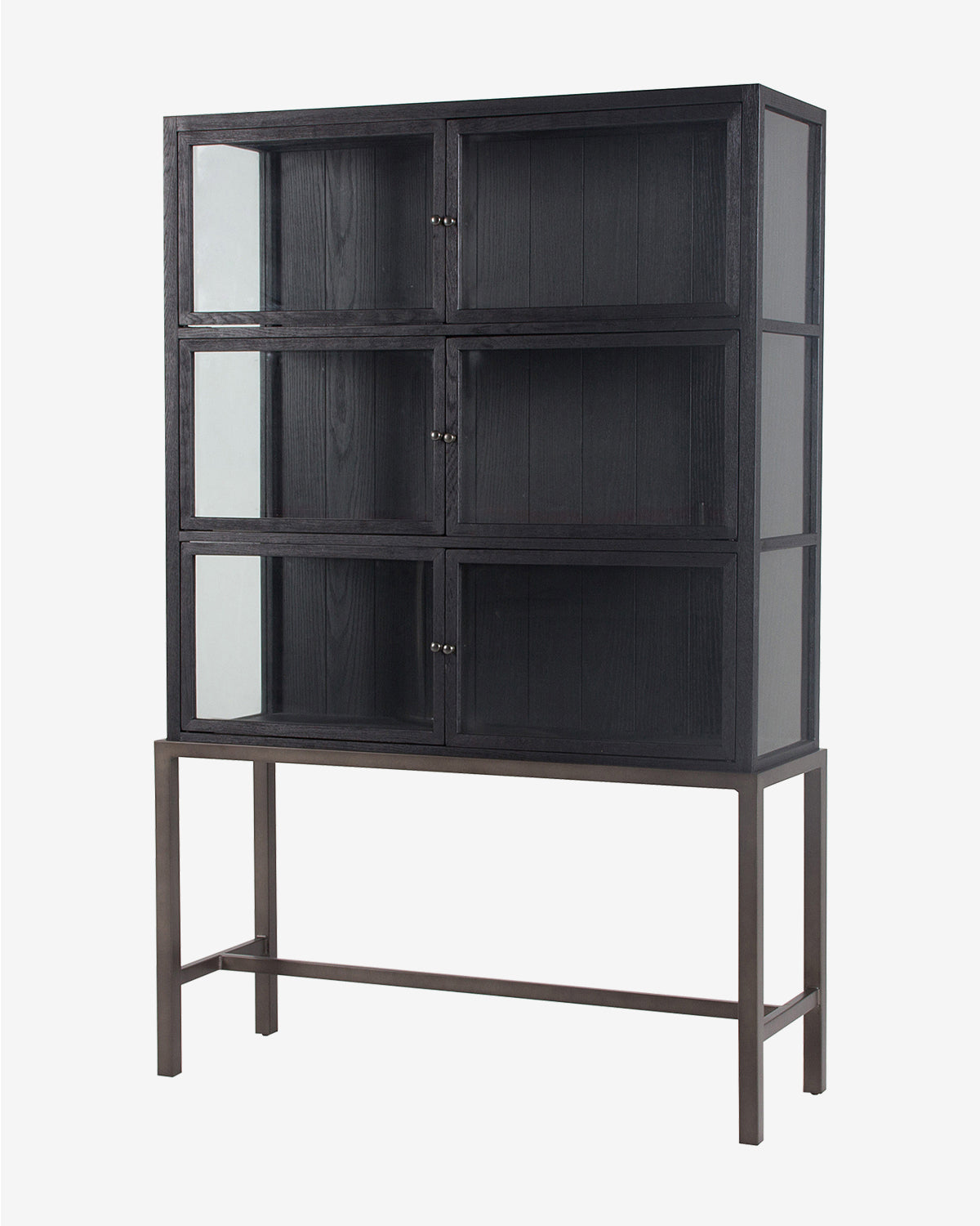 The Lawley Cabinet is a tall, black wooden curio cabinet with six glass-front compartments, set on a sleek metal frame with four legs and a crossbar. Its modern, minimalist design makes it a stylish storage solution by McGee & Co.