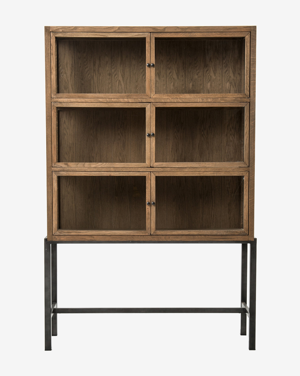 The Lawley Cabinet is a tall, drift oak curio with six glass-front compartments and black knobs on a black metal frame. Its minimalist, modern design brings elegance to any space, by McGee & Co.