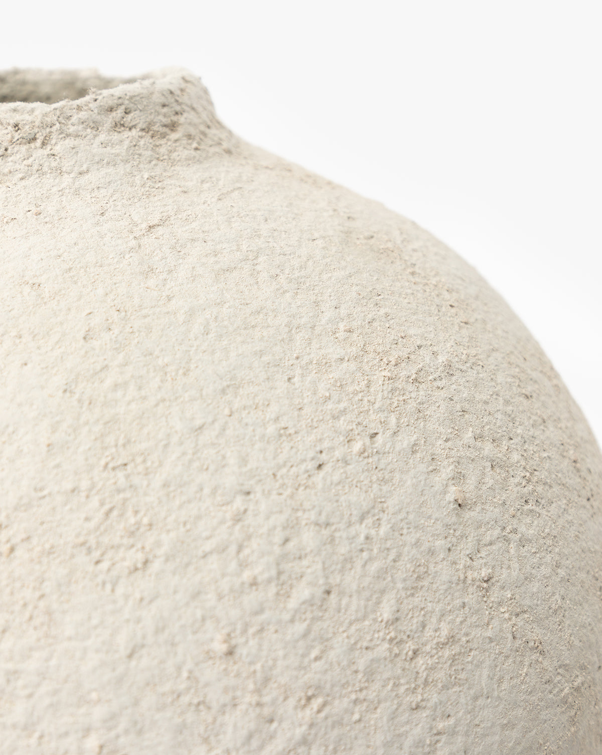 Close-up of the LeBeau Paper Mache Vase, featuring a textured off-white surface and an uneven, rounded shape that emphasizes its organic charm against a plain white background, by McGee & Co.