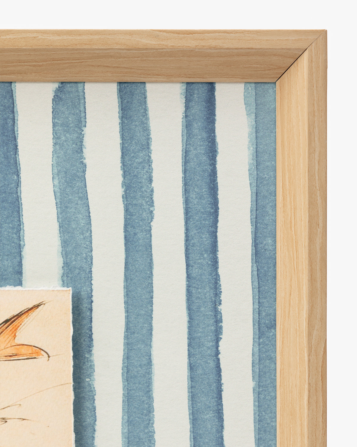 A close-up of a wooden picture frame features Leaping Doe among the Flowers, a giclee print with vertical blue watercolor stripes and part of a does ear visible in the bottom left corner by McGee & Co.