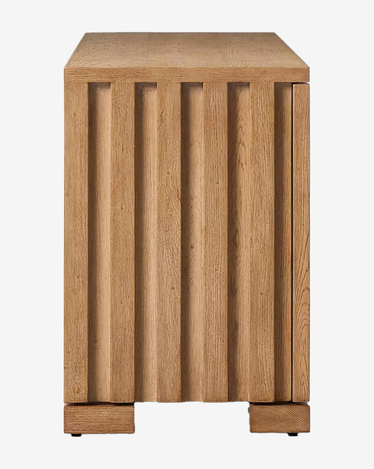 The Leith Console is a long, rectangular oak bench featuring vertical slats, a natural wood finish, and four block-style feet—a perfect piece of contemporary furniture, by McGee & Co.