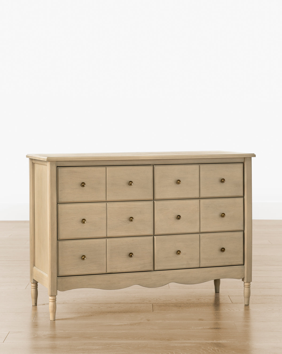 The Liberty 6-Drawer Assembled Dresser is crafted from sustainable pine wood with six spacious drawers and simple round knobs. Its timeless design stands on four tapered legs, blending eco-friendly style with classic functionality by McGee & Co.