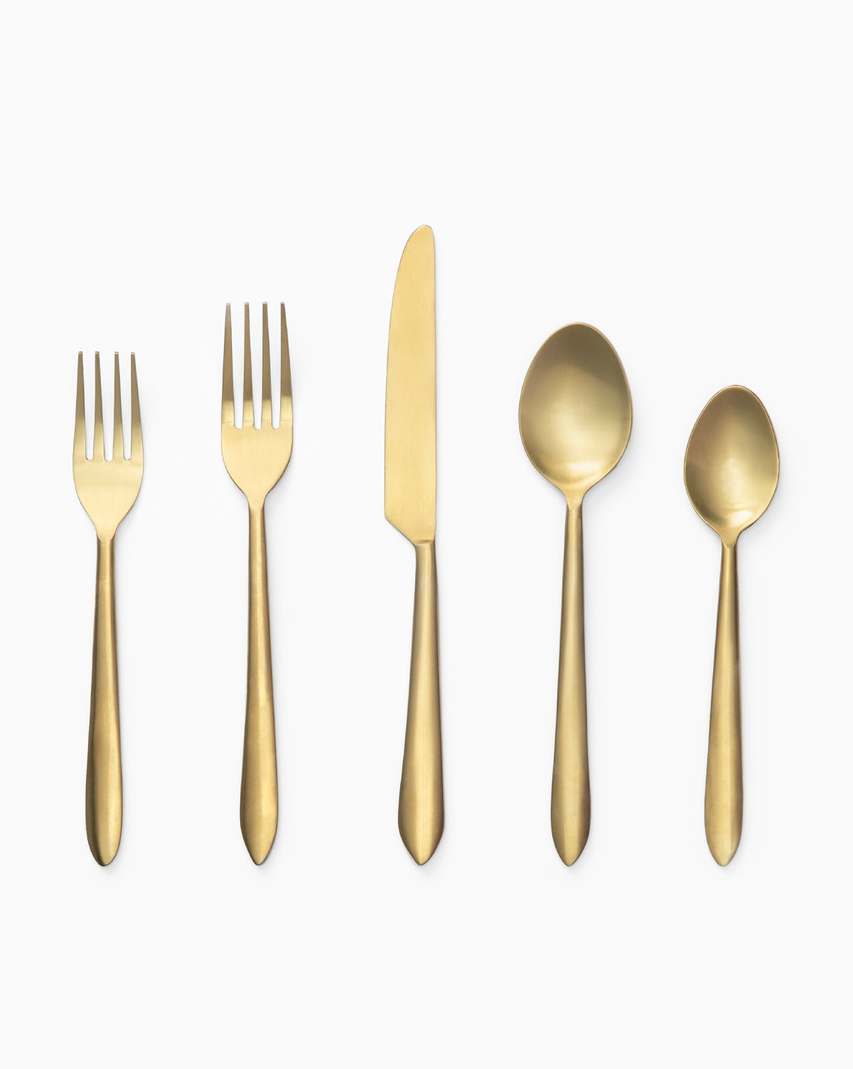 The Lilia Flatware Set of 5—two forks, a knife, a soup spoon, and a teaspoon in gold-tone stainless steel—is arranged in a row on a plain white background.