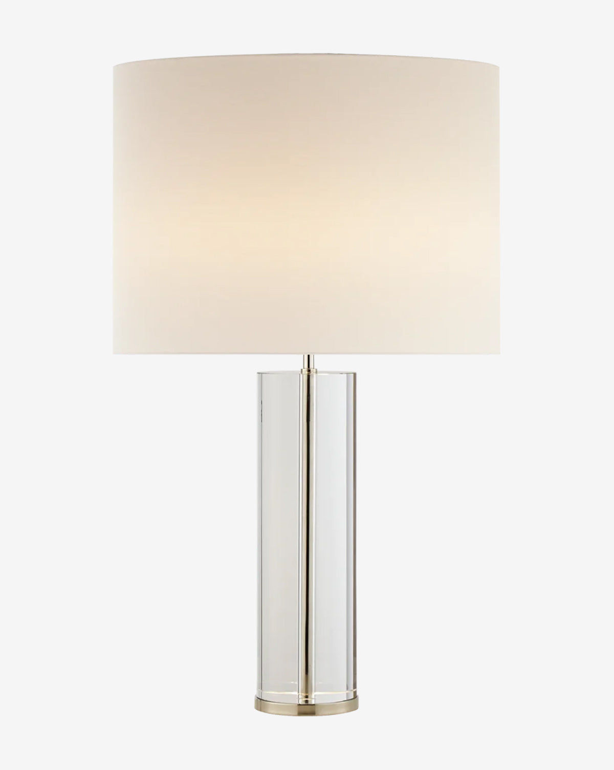 The Lineham Table Lamp features a modern cylindrical clear glass base and a large round white fabric lampshade, softly glowing with ambient light by McGee & Co.