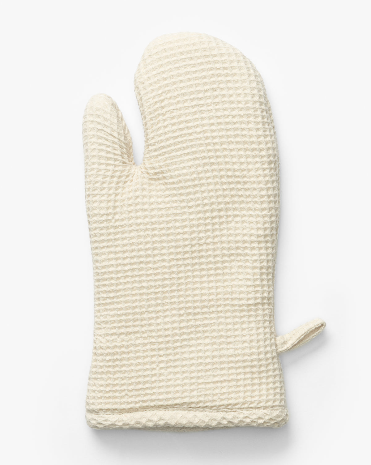 The Linen Blend Waffle Oven Mitt, featuring a textured white waffle design, a thumb section, and a hanging loop, is displayed against a plain white background by McGee & Co.