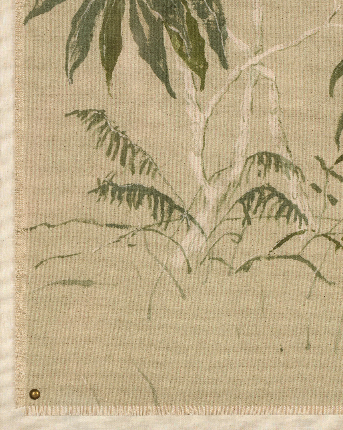 Linen Chinoiserie by Laurel-Dawn Latshaw features beige fabric with a subtle, painted design of leafy green plants and slim tree trunks—a modern take on chinoiserie. The textile is pinned at the bottom left corner with a small brass tack, by McGee & Co.