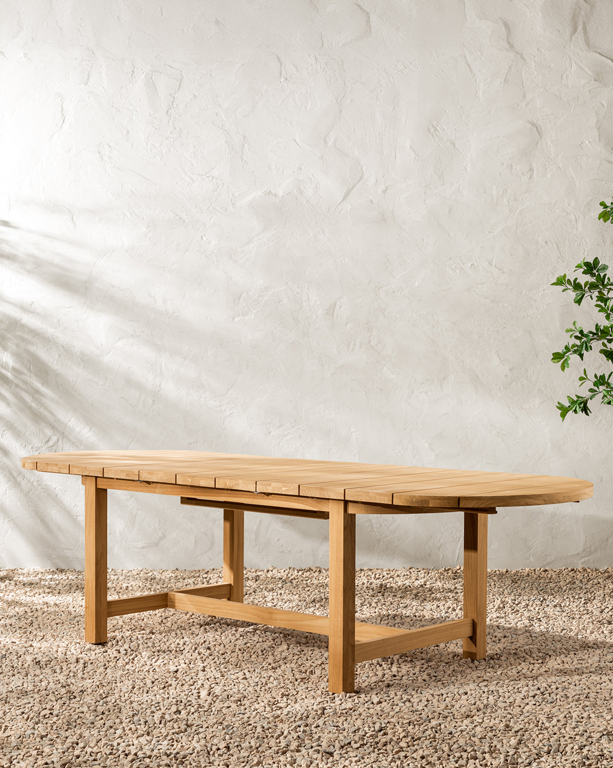 McGee & Co. teak wood outdoor dining table with extension.