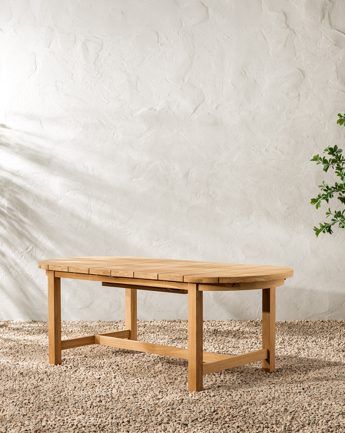 McGee & Co. teak wood outdoor dining table with extension.