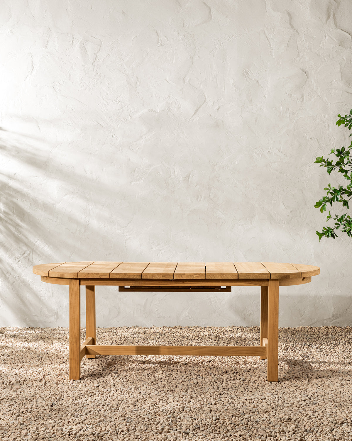 McGee & Co. teak wood outdoor dining table with extension.