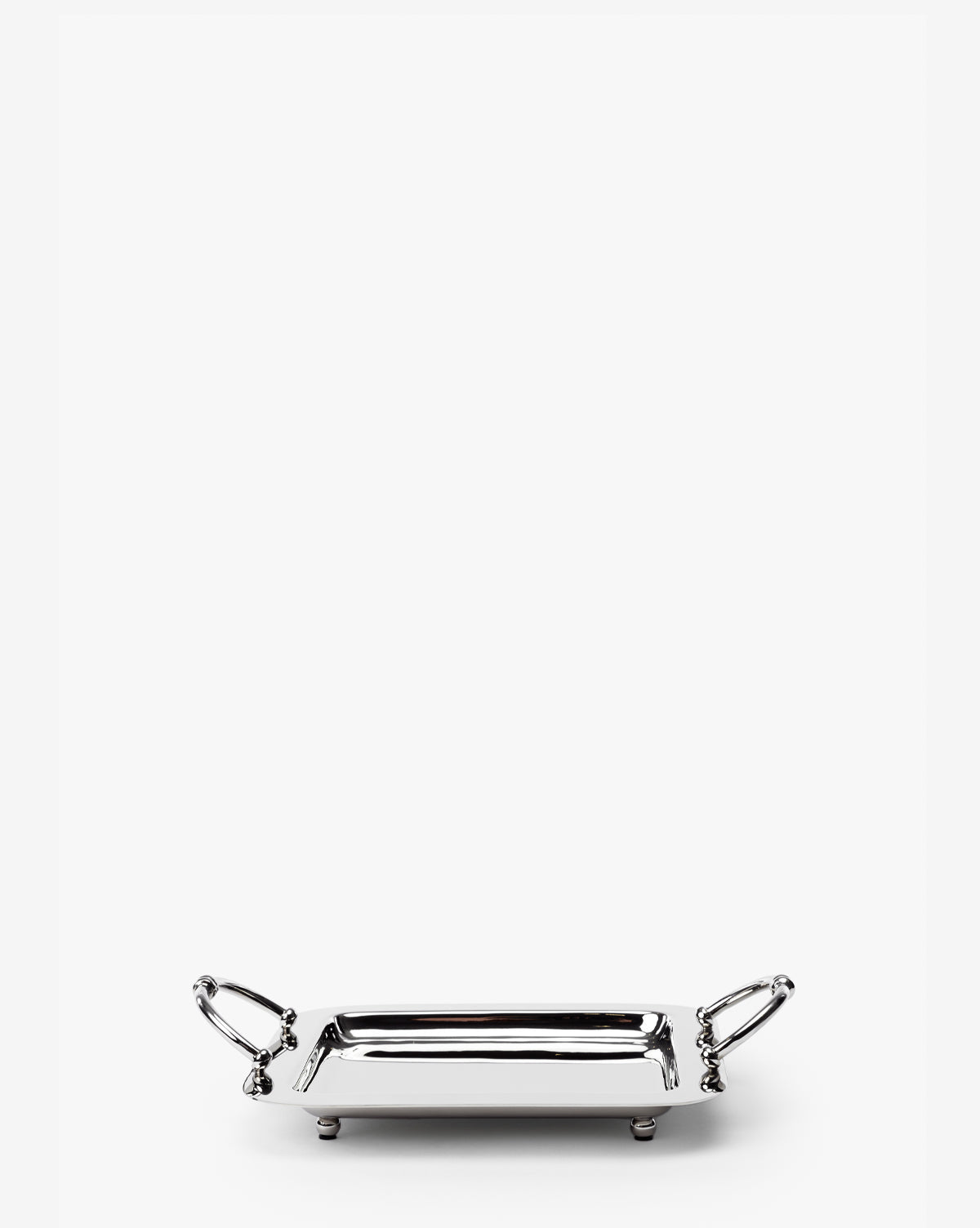 The Lionel Tray is a small, rectangular tray with a nickel finish, two decorative handles on the short sides, and four rounded feet, shown against a plain white background by McGee & Co.