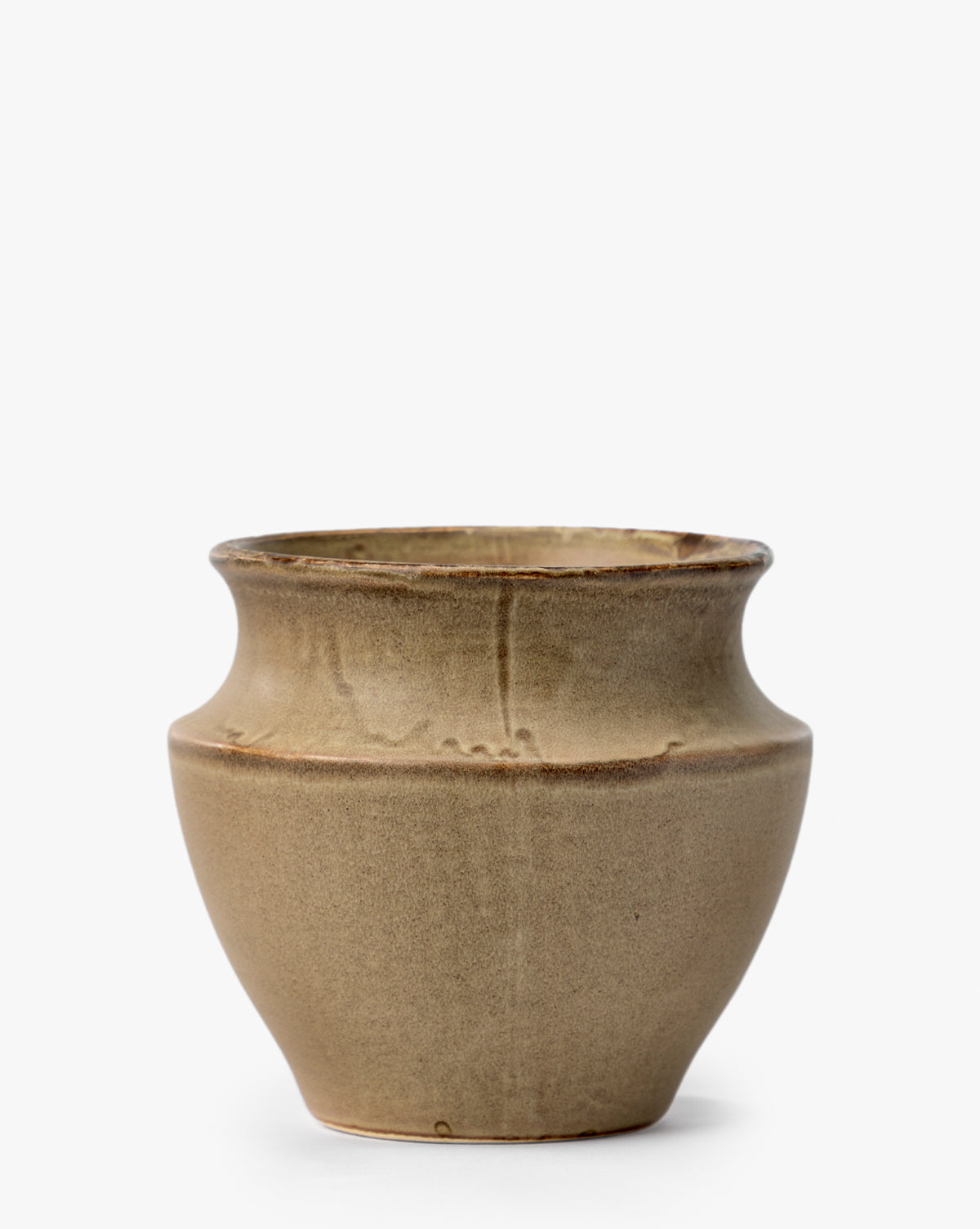 The Liora Pot is a small, round beige ceramic planter with a wide mouth, gently flared rim, smooth finish, and slightly tapered base—an elegant decorative piece for any space, by McGee & Co.