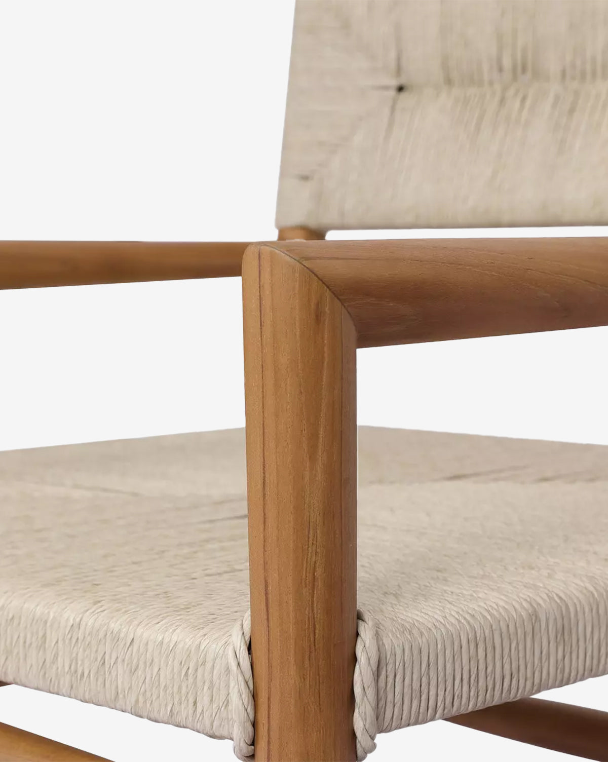 The Lockridge Outdoor Chair showcases a sleek teak frame and light woven rope seat and backrest, emphasizing its detailed texture and expert craftsmanship—ideal for stylish outdoor seating, by McGee & Co.