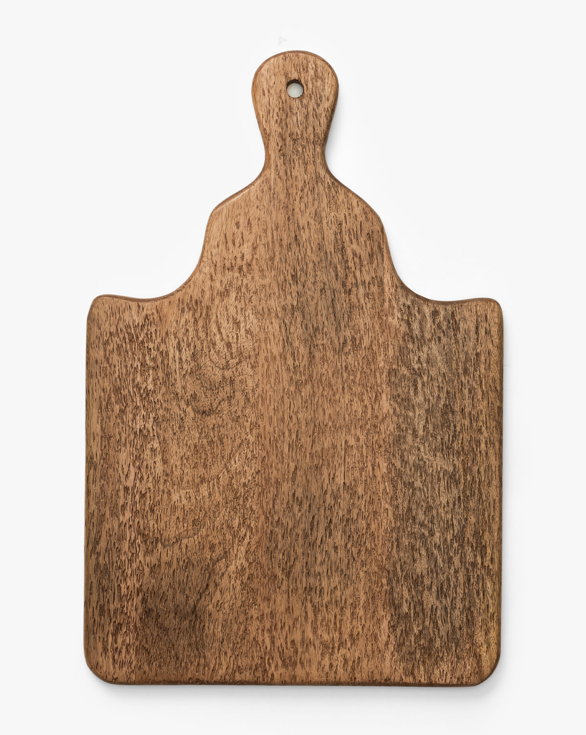 The Longfellow Breadboard, made of mango wood with a handle, rounded edges, and a small hole at the tip, adds rustic charm to your kitchen decor and is shown on a white background by McGee & Co.