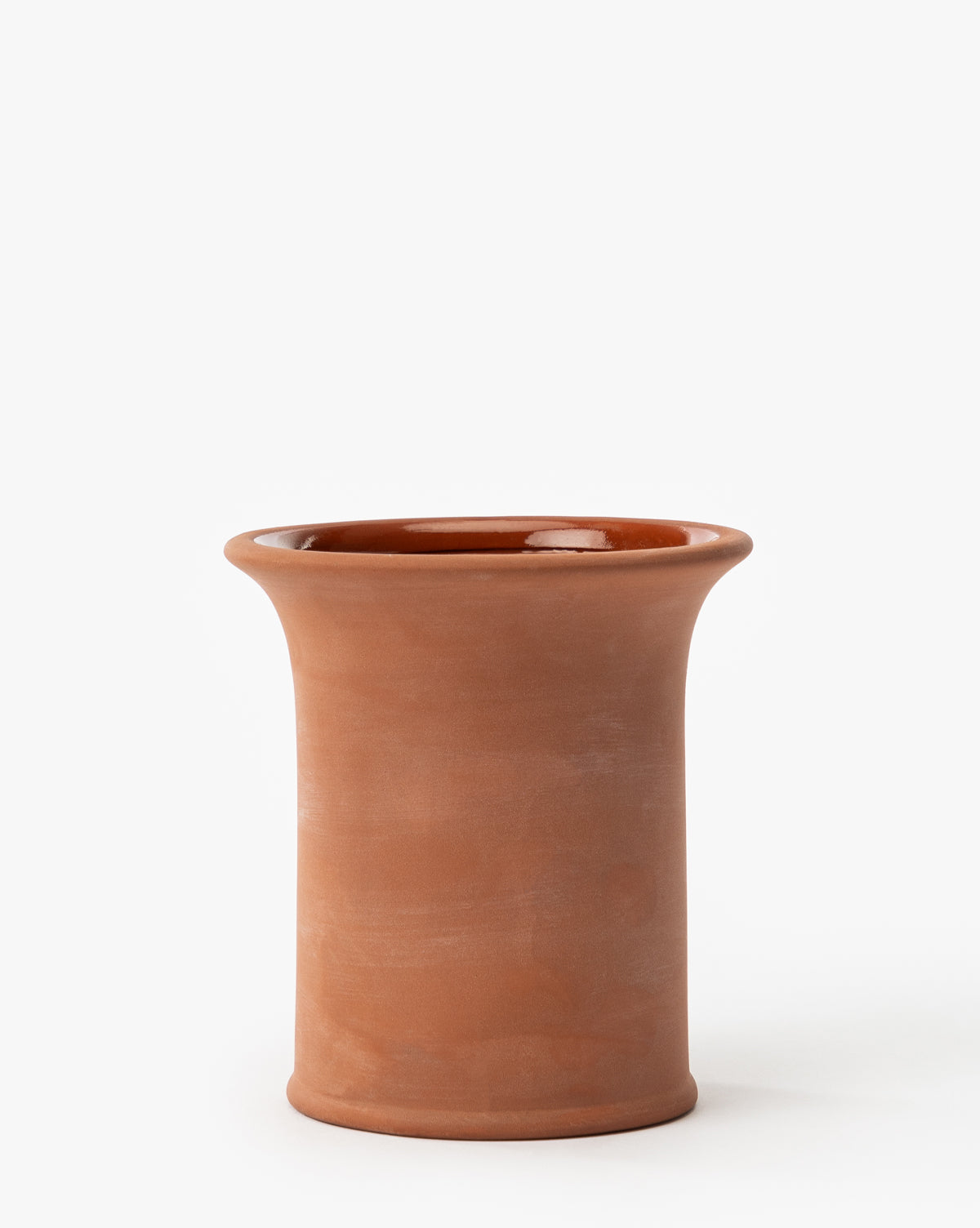 The Lorenzo Terracotta Pot is a cylindrical planter with a wide, flared rim and smooth finish, ideal for indoor or outdoor use, shown against a plain white background, by McGee & Co.