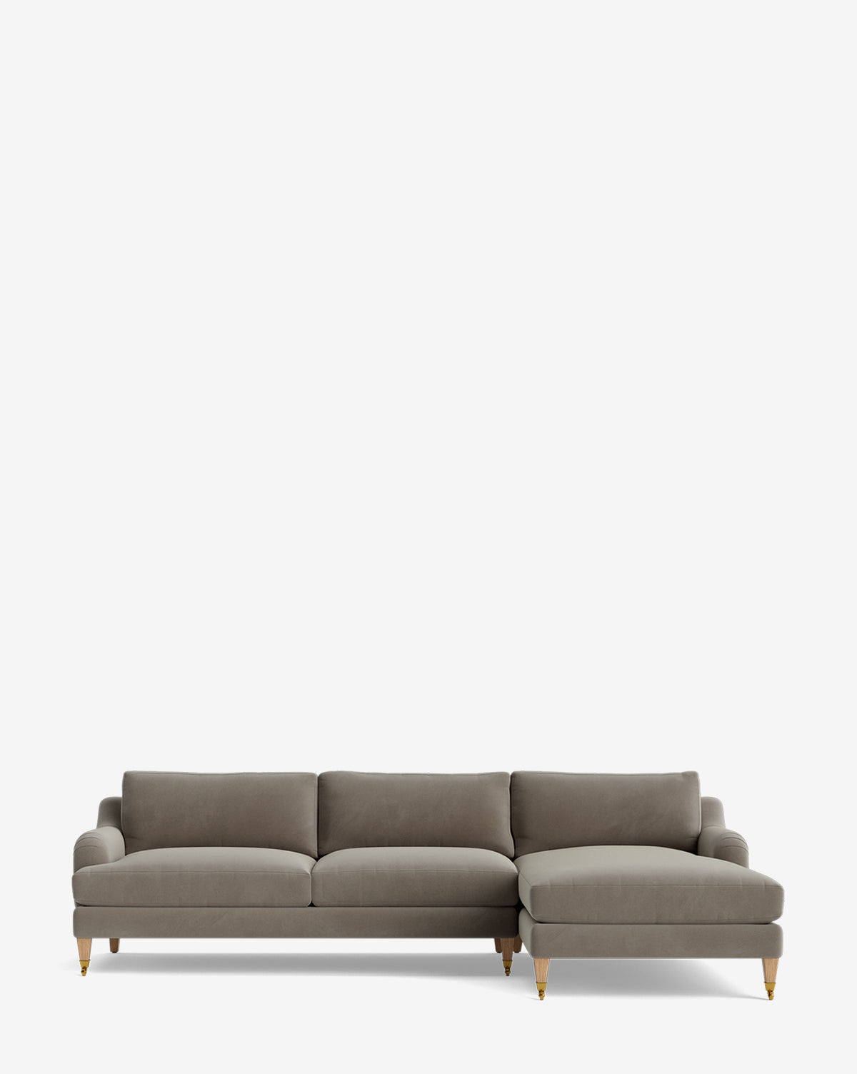 The Lucille English Roll Arm Right Chaise Sectional 107 is a modern gray sectional with three seat cushions, a right chaise lounge, slim arms, wooden legs with brass caster wheels, and plush down-wrapped cushions on a plain white background by McGee & Co.