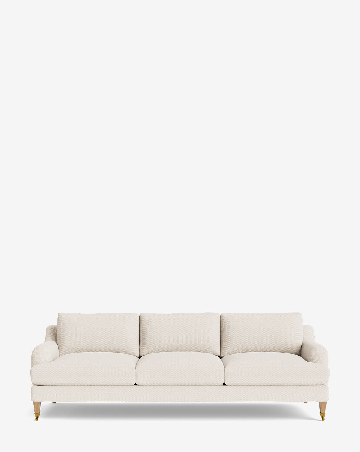 The Lucille English Roll Arm Sofa 90.5 features light beige upholstery, three down-wrapped seat cushions, rounded arms, and wooden legs with brass wheels, all set against a plain white background by McGee & Co.