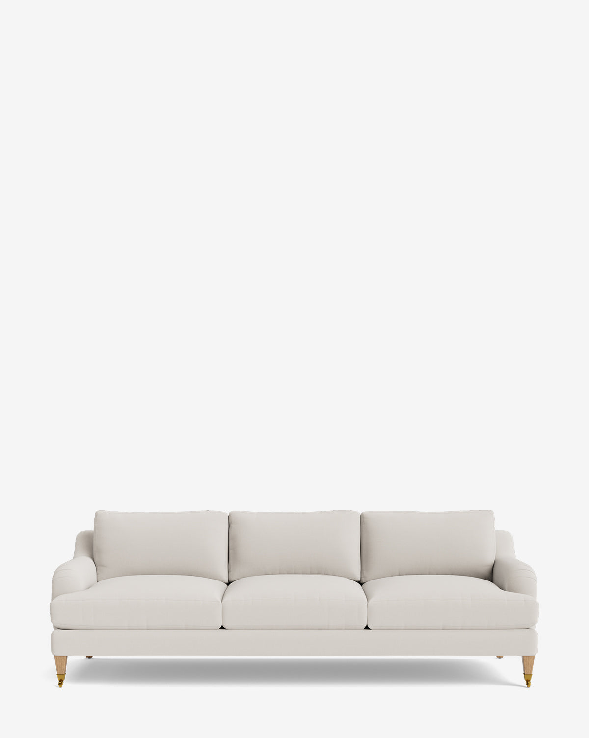The Lucille English Roll Arm Sofa 90.5 features light beige upholstery, down-wrapped cushions, rounded armrests, and short wooden legs with brass casters, shown against a plain white background by McGee & Co.