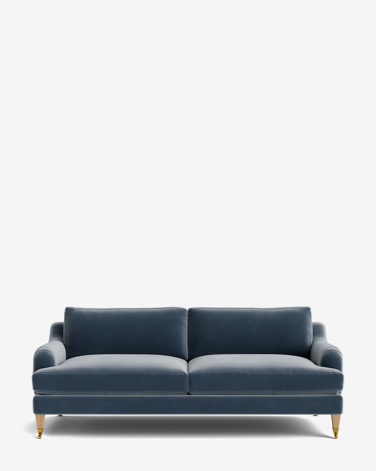 The Lucille English Roll Arm Sofa 78 features modern blue velvet upholstery, two down-wrapped seat cushions, customizable options, and short wooden legs with brass casters, styled against a plain white background by McGee & Co.