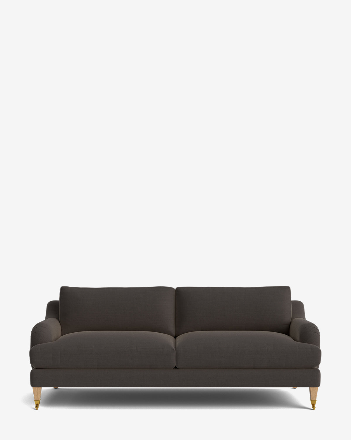 The Lucille English Roll Arm Sofa 78 in dark grey features upholstered cushions, rounded armrests, and wooden legs with brass castor wheels, shown against a plain white background by McGee & Co.