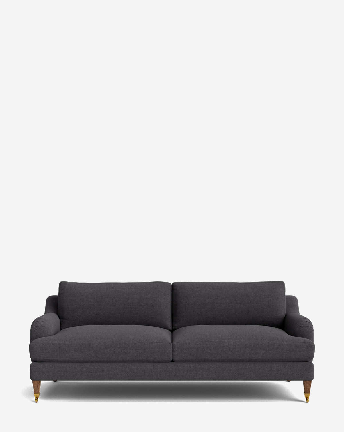 The Lucille English Roll Arm Sofa 78 features dark gray upholstery, two down-wrapped seat cushions, a low backrest, and wooden legs with brass casters, shown against a plain white background by McGee & Co.