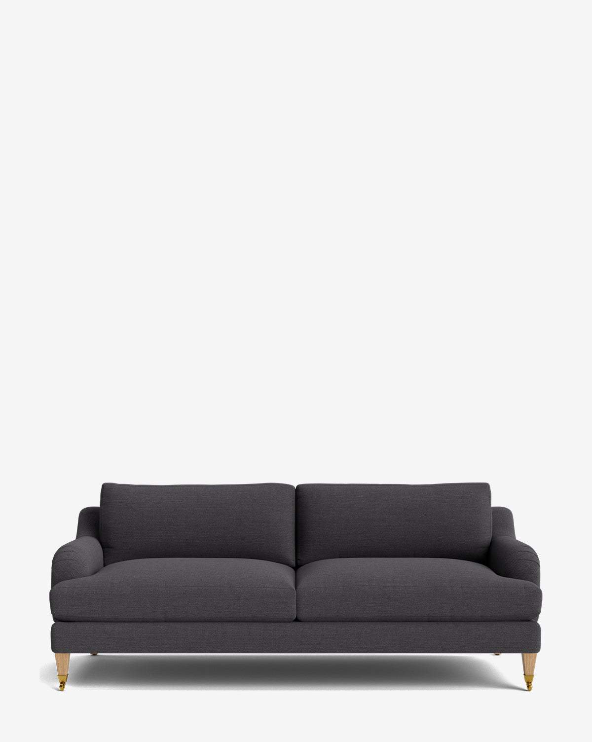The Lucille English Roll Arm Sofa 78 is a modern dark gray piece with two down-wrapped seat cushions, four short wooden legs with brass tips, and slightly rounded arms for enhanced comfort and style, shown against a plain white background by McGee & Co.