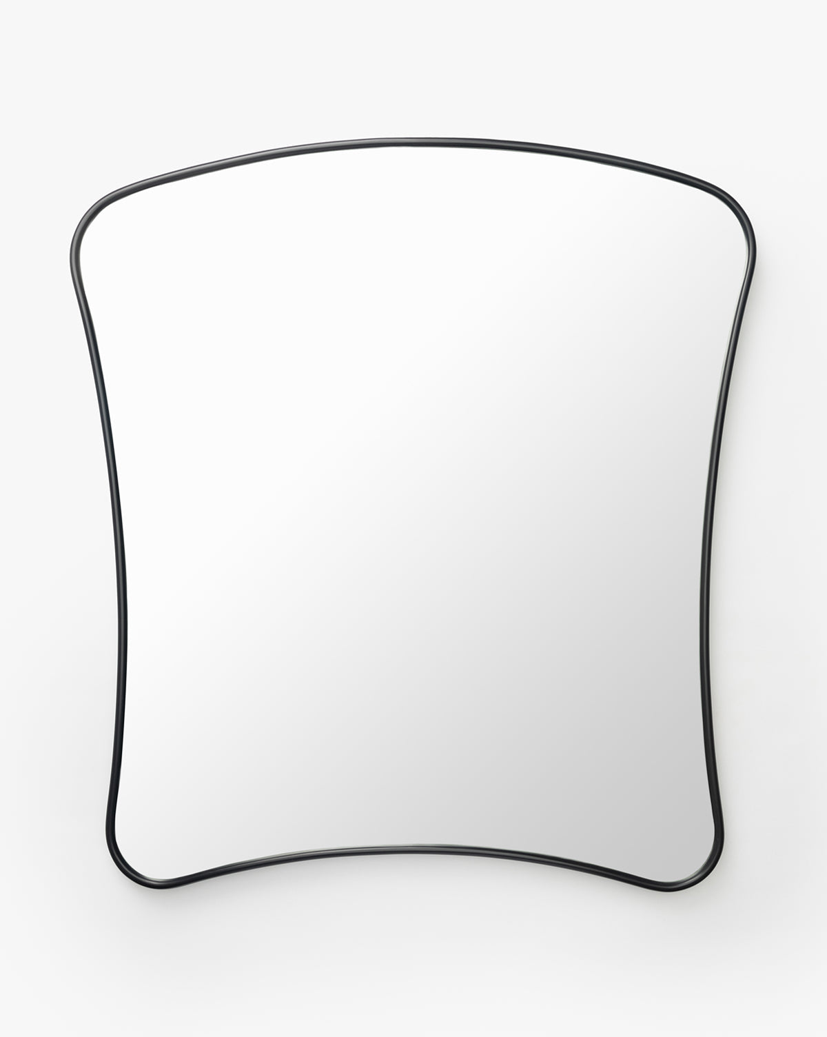 The Ludwig Wall Mirror features a thin black frame and a gently curved, irregular rectangular shape, shown against a plain white background, by McGee & Co.