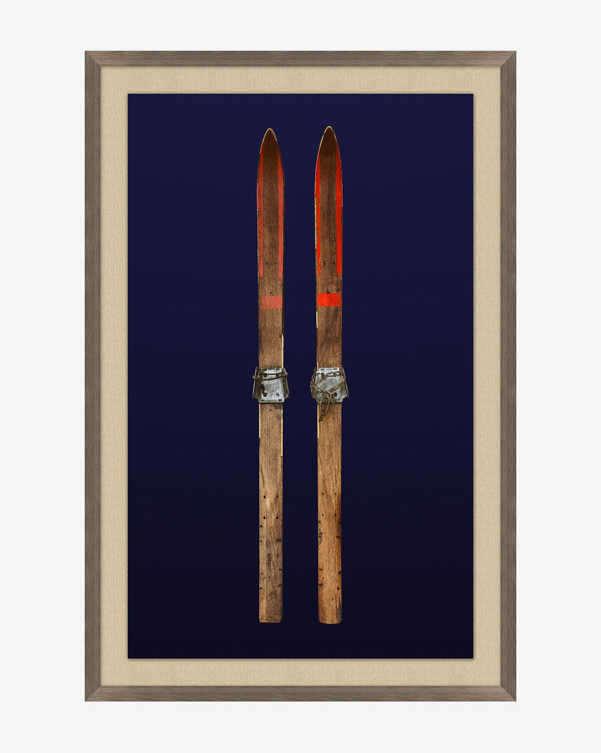 Antique Navy Skis I: A giclee print of vintage navy skis with metal bindings against a dark blue background, beautifully framed in dark walnut woodgrain.
