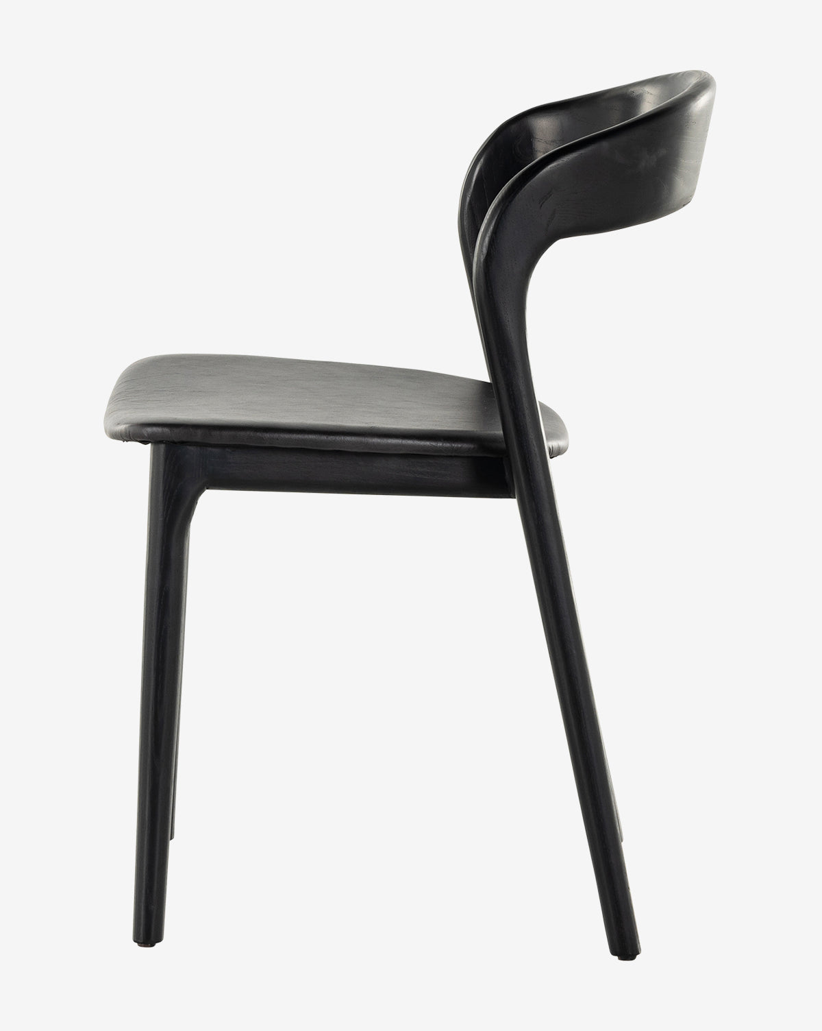 The Lucinda Dining Chair features a modern, minimalist design with a curved backrest and seat. Shown in profile against a plain white background, its sleek lines highlight Scandinavian-inspired style by McGee & Co.