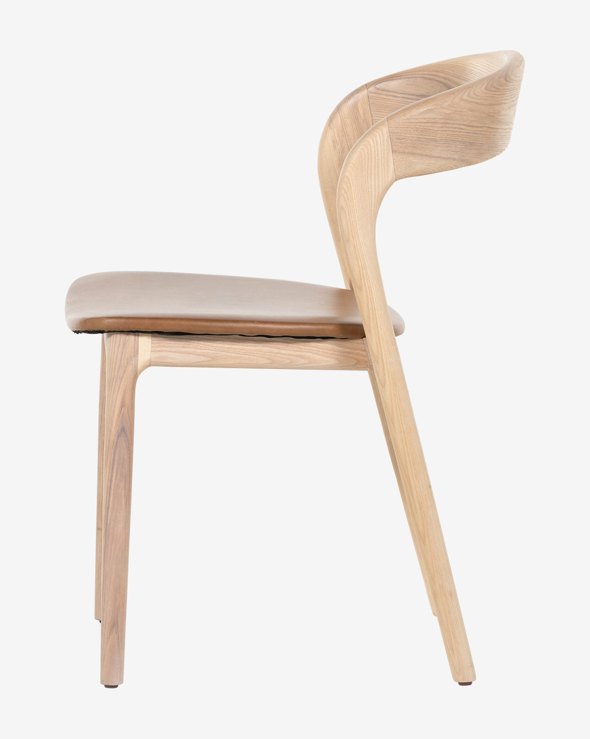 The Lucinda Dining Chair, a modern wooden piece with Scandinavian design, features a curved backrest and cushioned seat. Shown in side profile against a plain white background by McGee & Co.