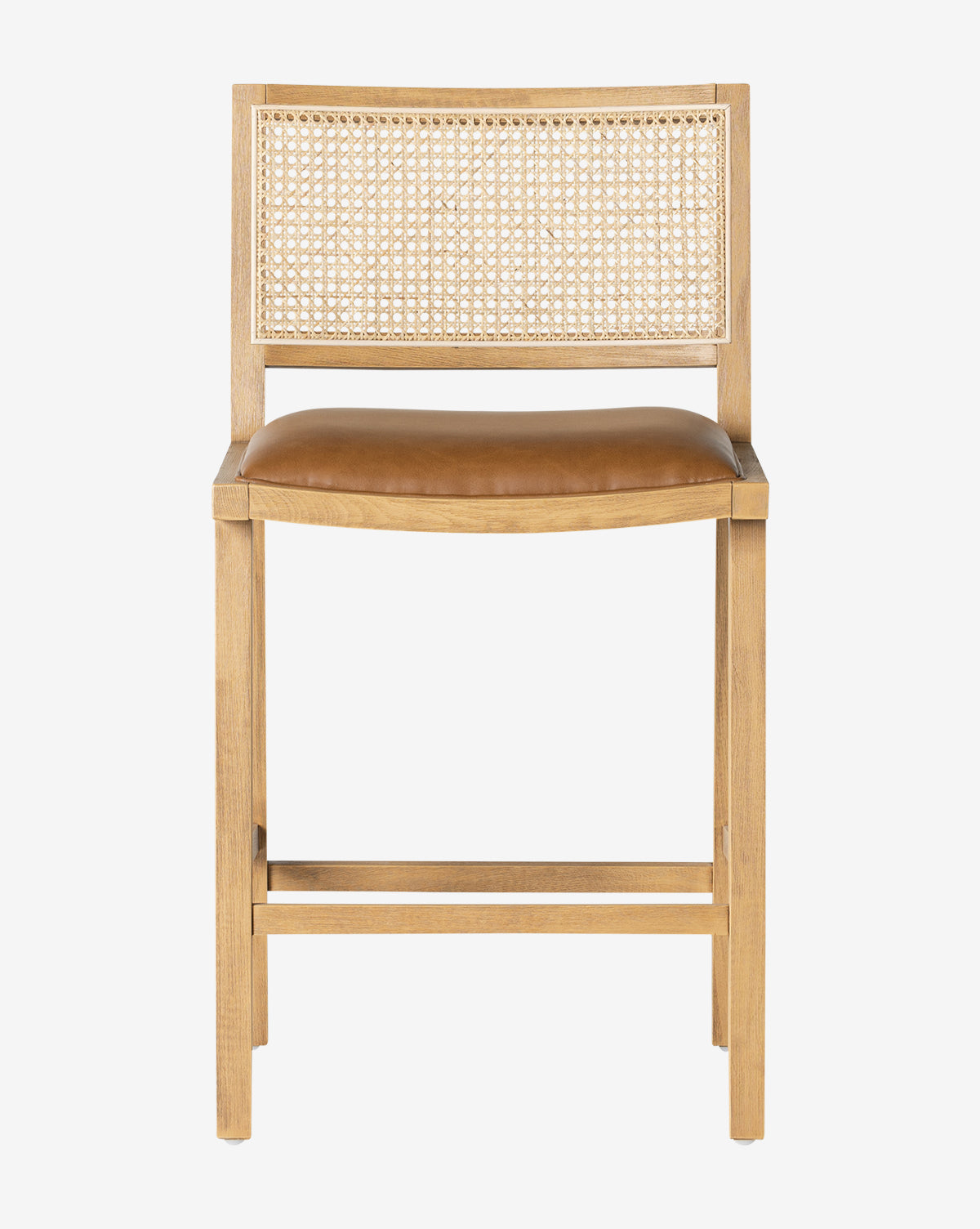 The Emeline Stool showcases a solid beech frame, woven cane backrest, and tan faux leather cushioned seat, displayed against a plain white background by McGee & Co.