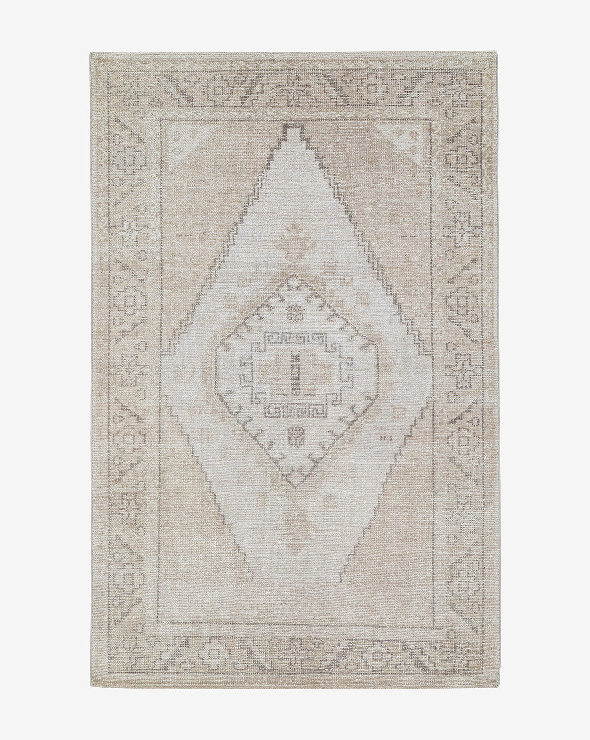 The Pembroke Hand-Knotted Wool Rug features a beige and cream vintage-inspired design with a faded geometric diamond center and subtle border, offering a timeless, distressed look ideal for any space, by McGee & Co.