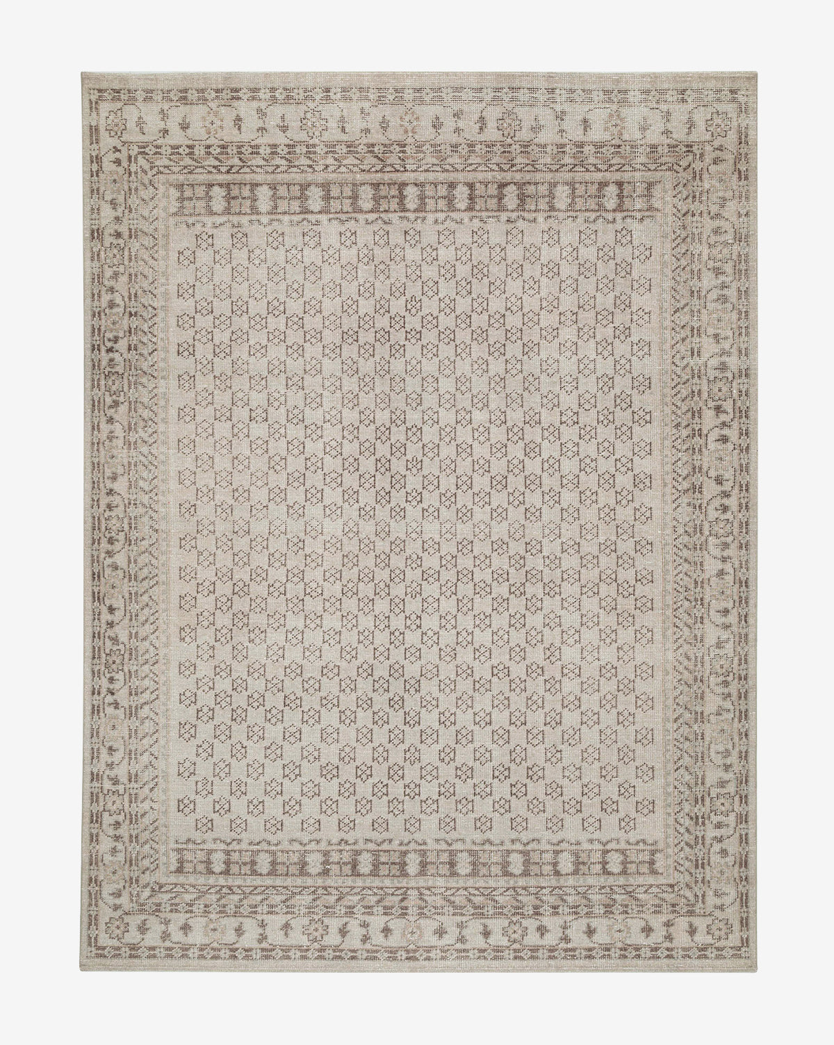The Anya Neutral Hand-Knotted Wool Rug features an intricate geometric and floral pattern in beige and light brown with a detailed border, offering a timeless, neutral accent for any space, by McGee & Co.