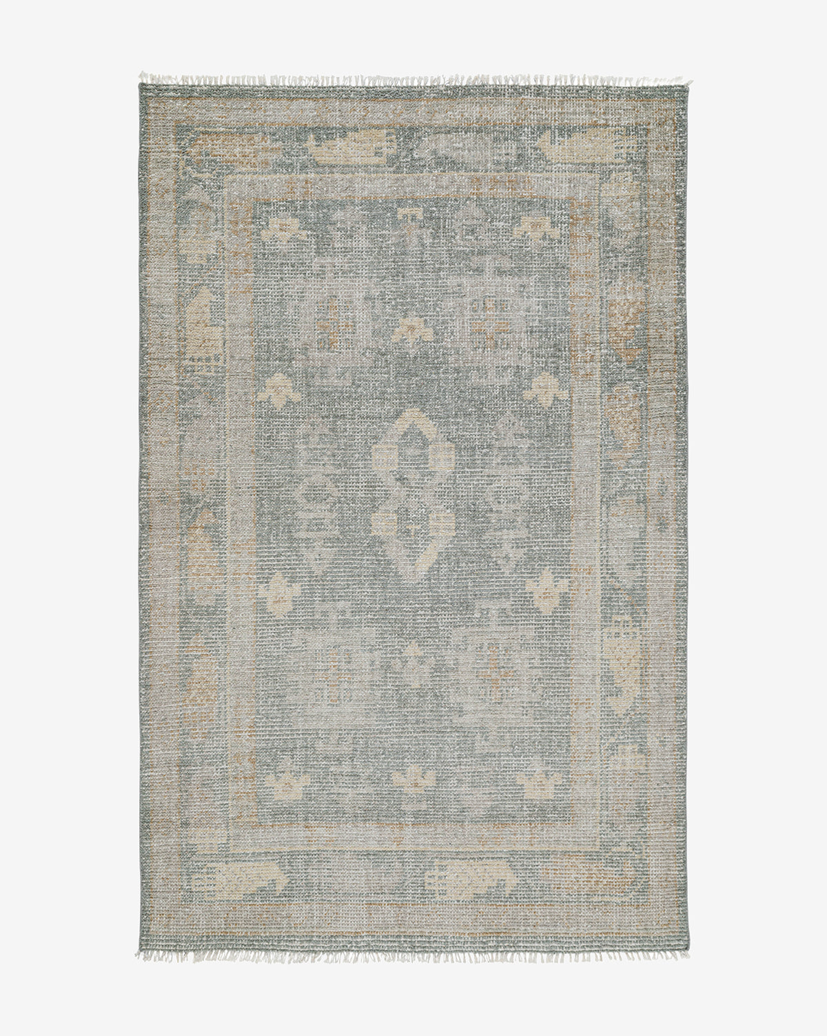 The Roslin Hand-Knotted Wool Rug features a faded, intricate pattern in muted gray, beige, and light blue tones, accented with a decorative border, geometric motifs, and short fringe along the rectangular edges, by McGee & Co.