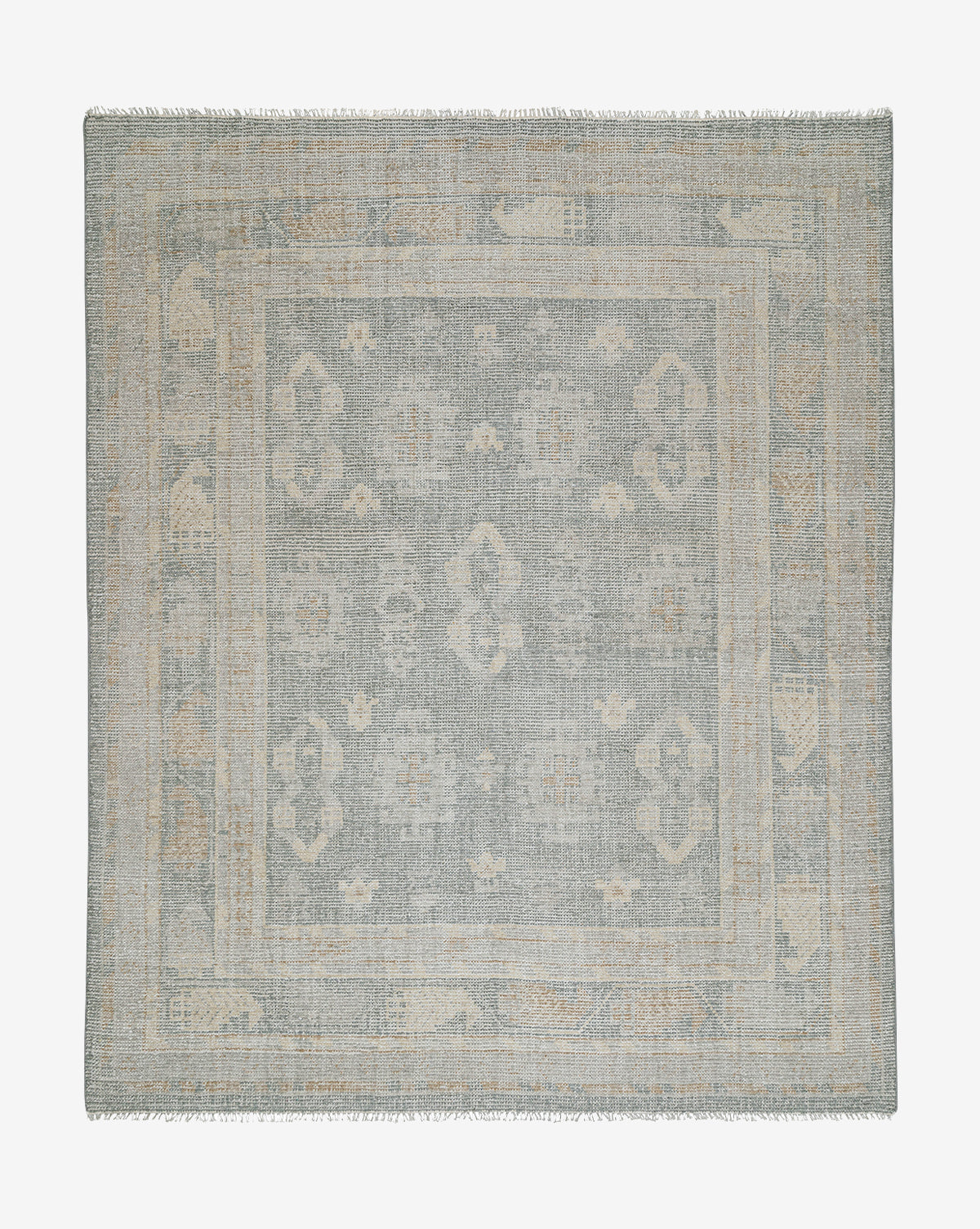 The Roslin Hand-Knotted Wool Rug is a square, flat-woven geometric rug with subtle floral patterns, fringed edges, and a muted blue-gray and beige palette, by McGee & Co.