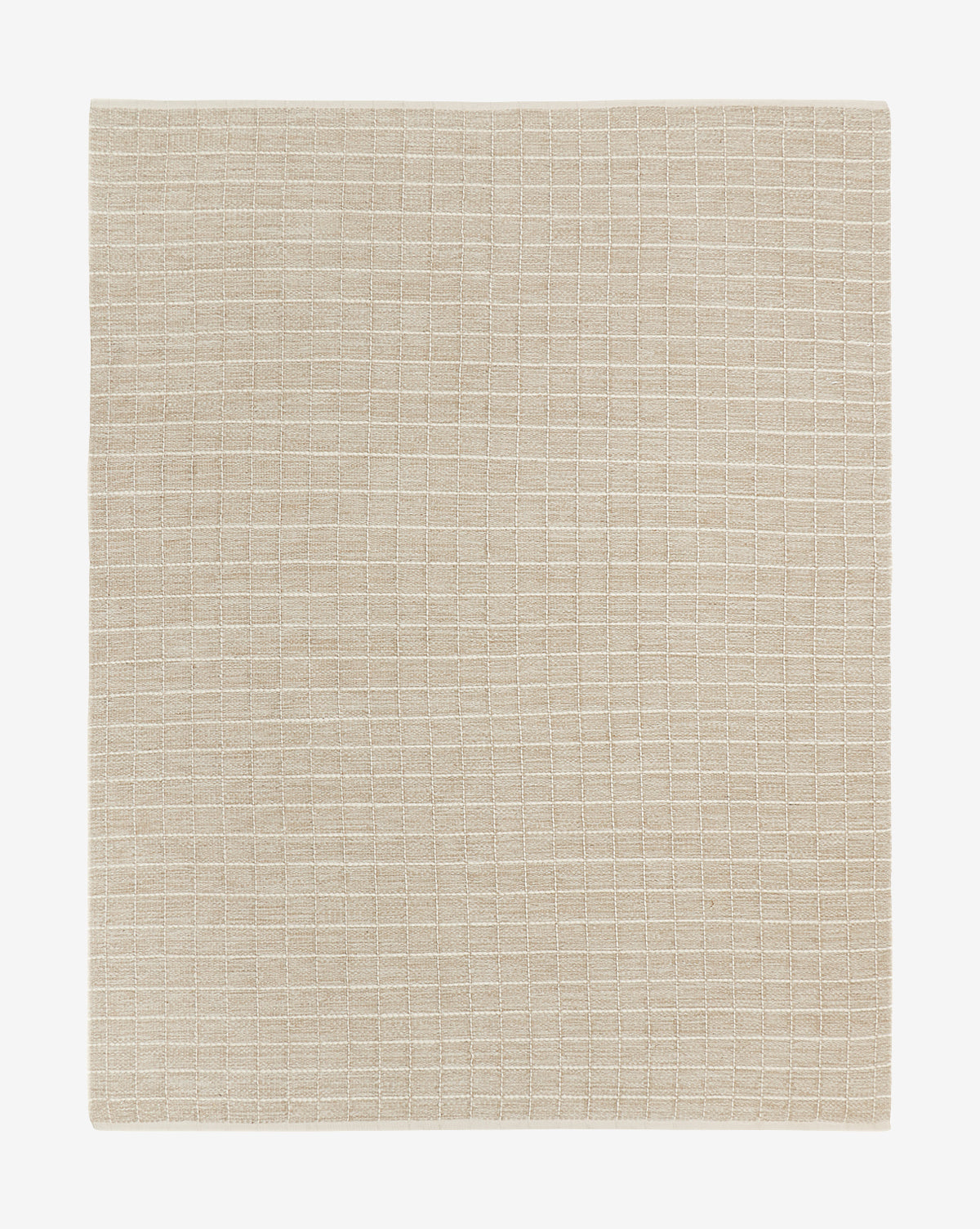 A beige cloth napkin with a white grid pattern lies flat on a white background—perfectly complementing the Nellie Handwoven Jute Rug for an effortlessly elegant tablescape, by McGee & Co.