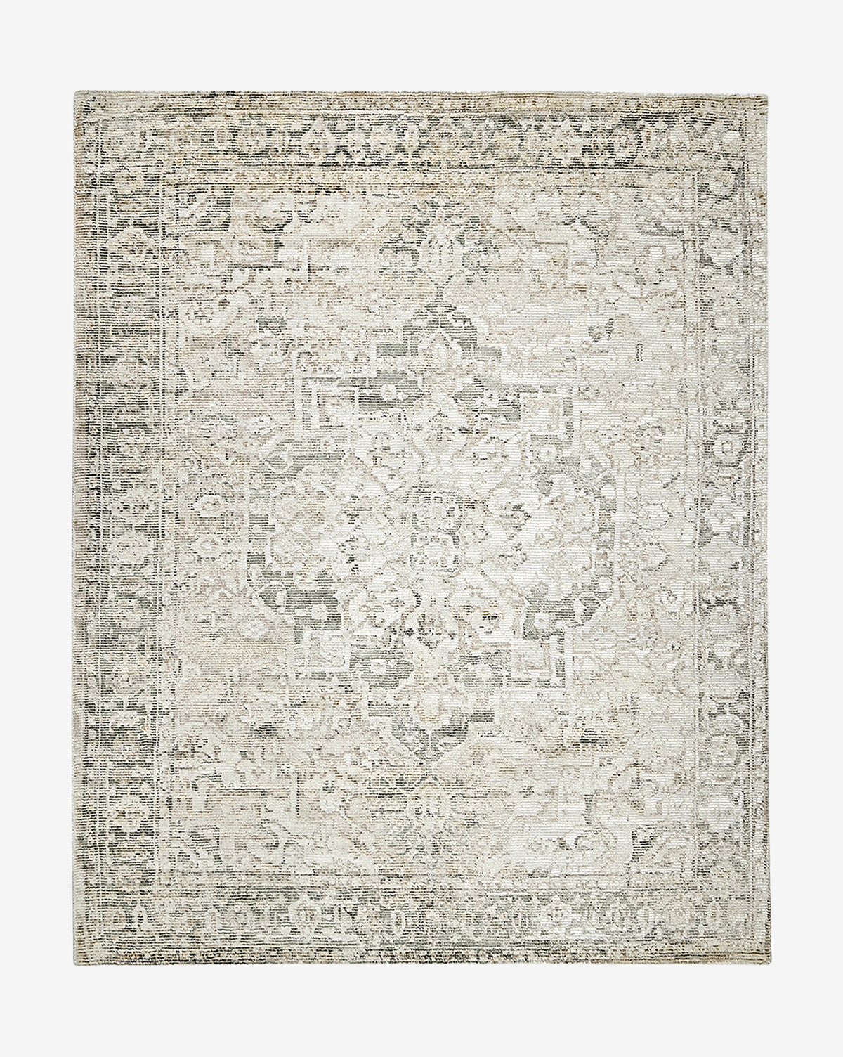 The Shayla Hand-Tufted Rug is a rectangular vintage-style rug with a faded medallion pattern and ornate borders, featuring muted ivory, beige, and gray tones.