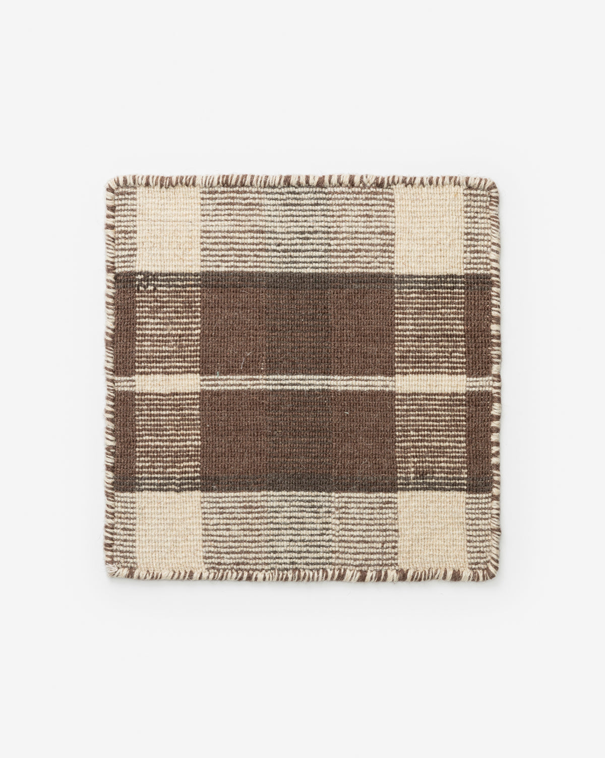 The Orton Rug Swatch is a rectangular, handwoven wool sample with a brown and beige plaid pattern of thick and thin stripes, finished with stitched edges, shown on a white background by McGee & Co.