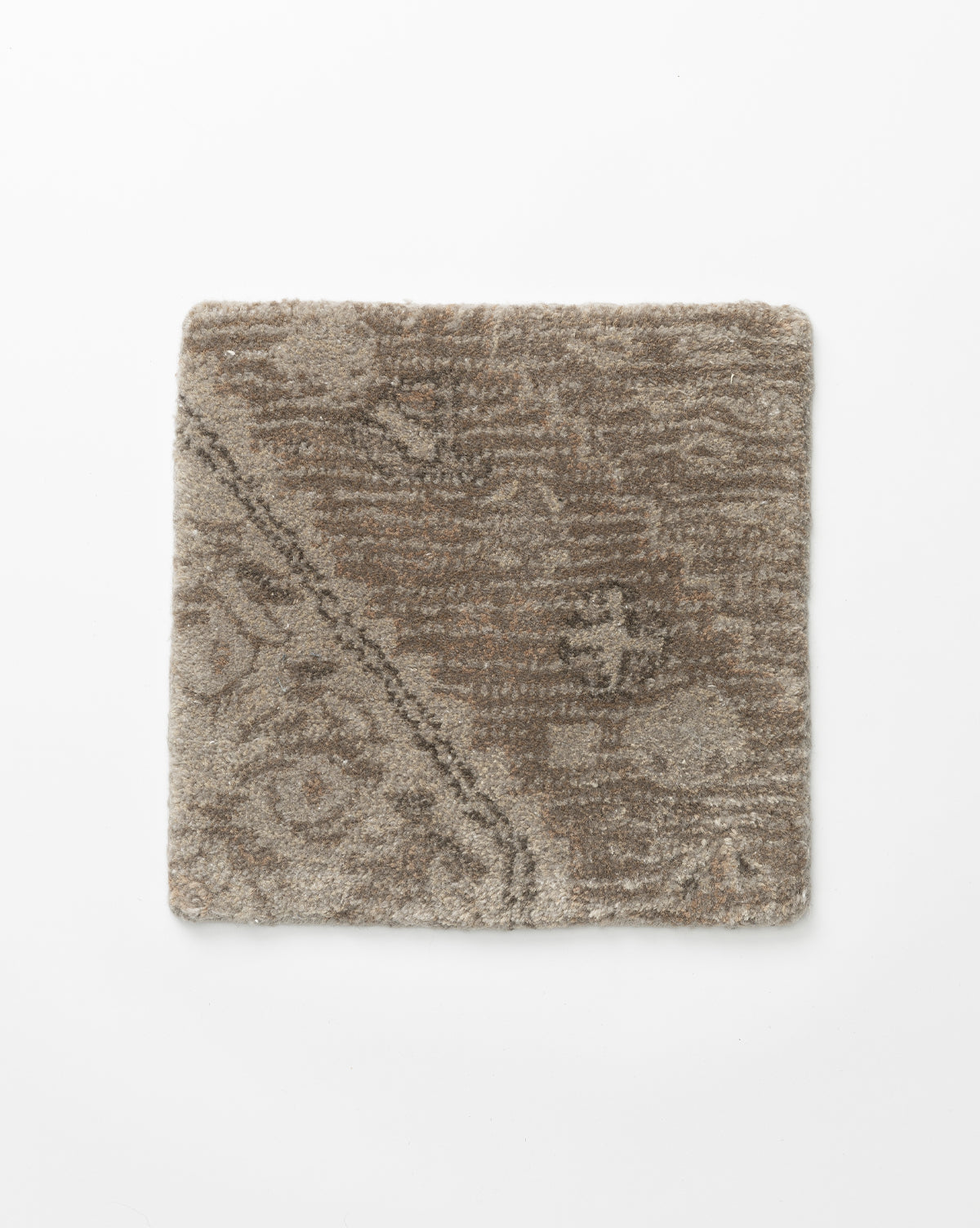 Square swatch of the Siyara Hand-Tufted Wool Rug in brown and beige, featuring a subtle abstract pattern with diagonal lines, displayed on a white background—crafted for style and durability, by McGee & Co.