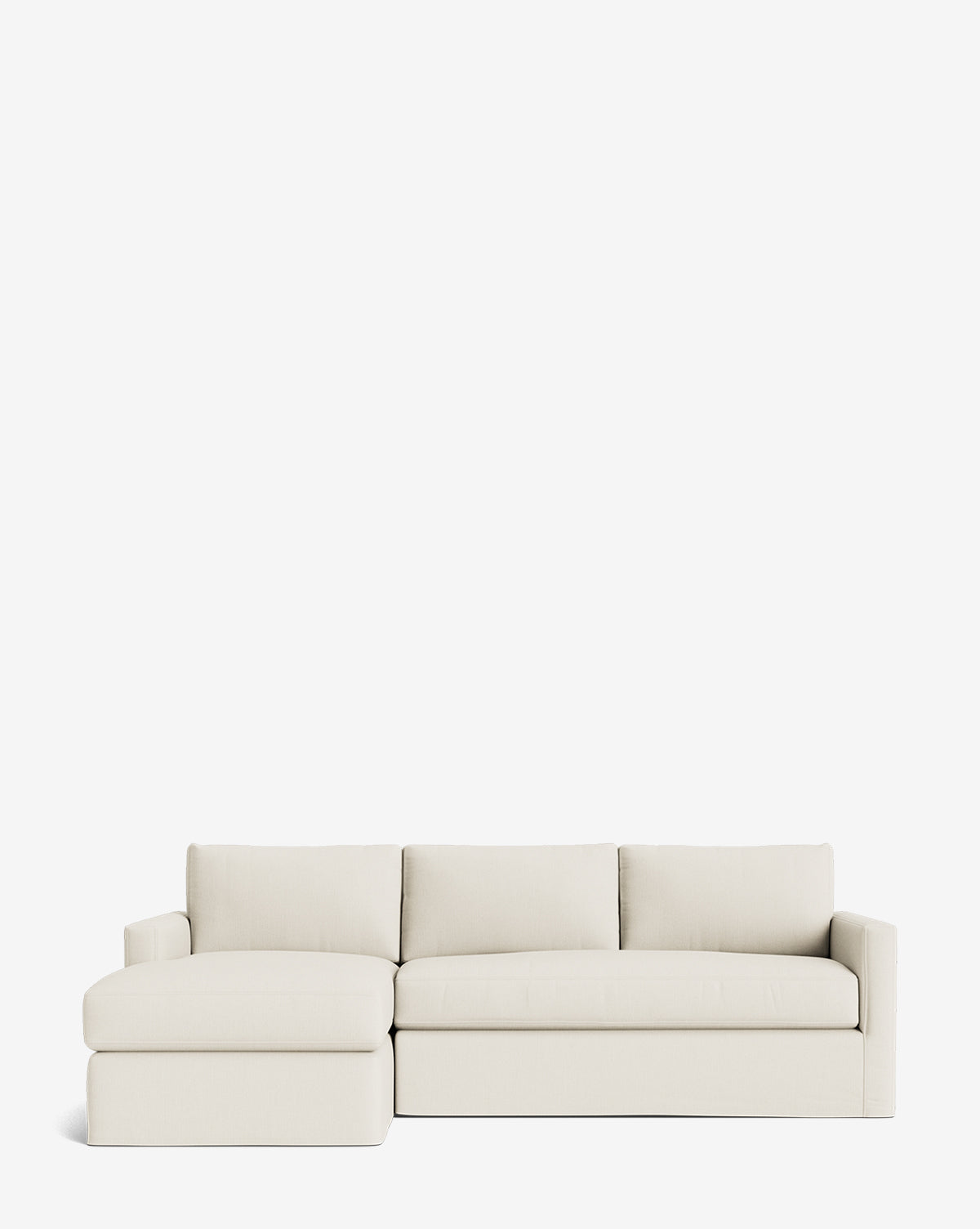 The Community Macy Slipcover Chaise Sectional 101 in light beige features clean lines, plush cushions, and a left-facing chaise lounge, set against a plain white background. McGee & Co.