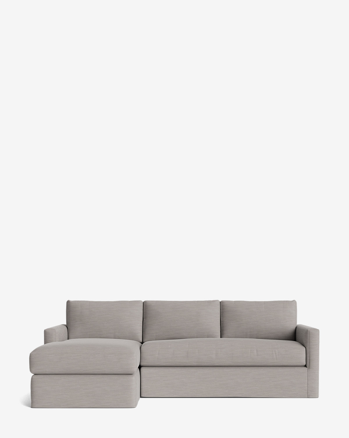 The Community Macy Slipcover Chaise Sectional 101 features a modern light gray design with three back cushions and a left-facing chaise lounge, highlighting its deep sectional look against a plain white background. McGee & Co.