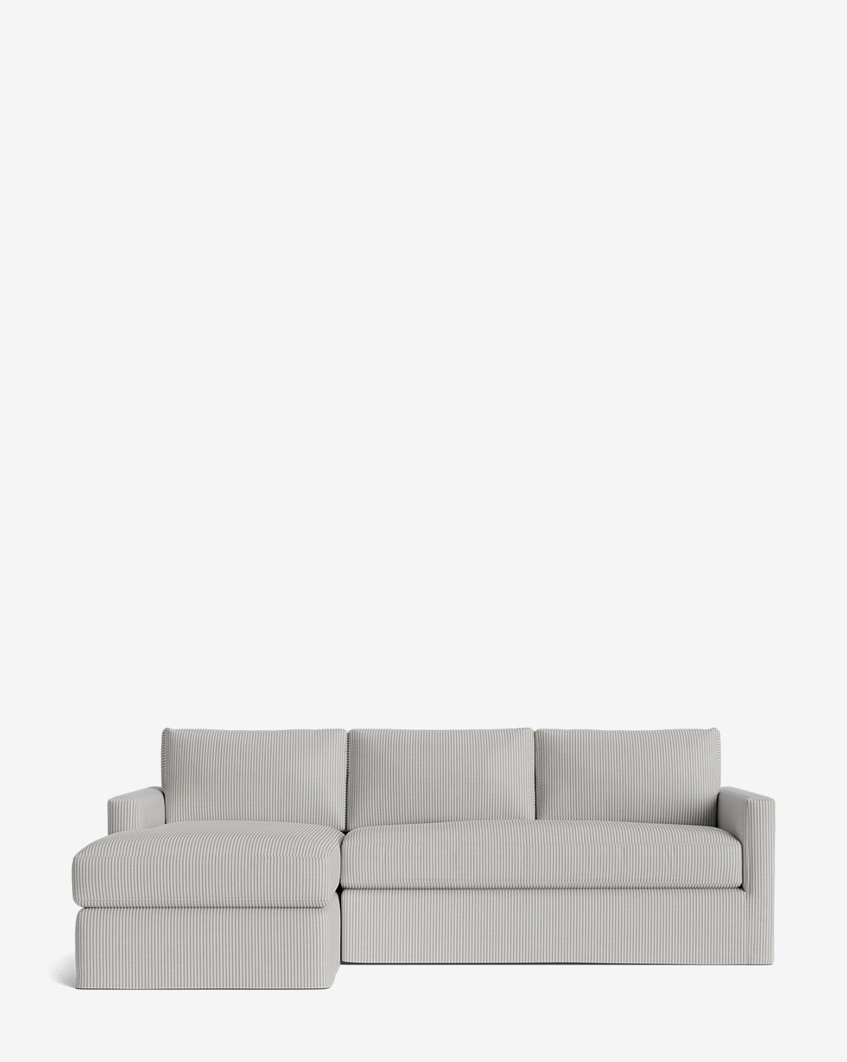 The Macy Slipcover Chaise Sectional 101 is a modern light gray sofa with a left-facing chaise, three back cushions, slim armrests, and subtle vertical stripe upholstery. Shown on a plain white background by McGee & Co.