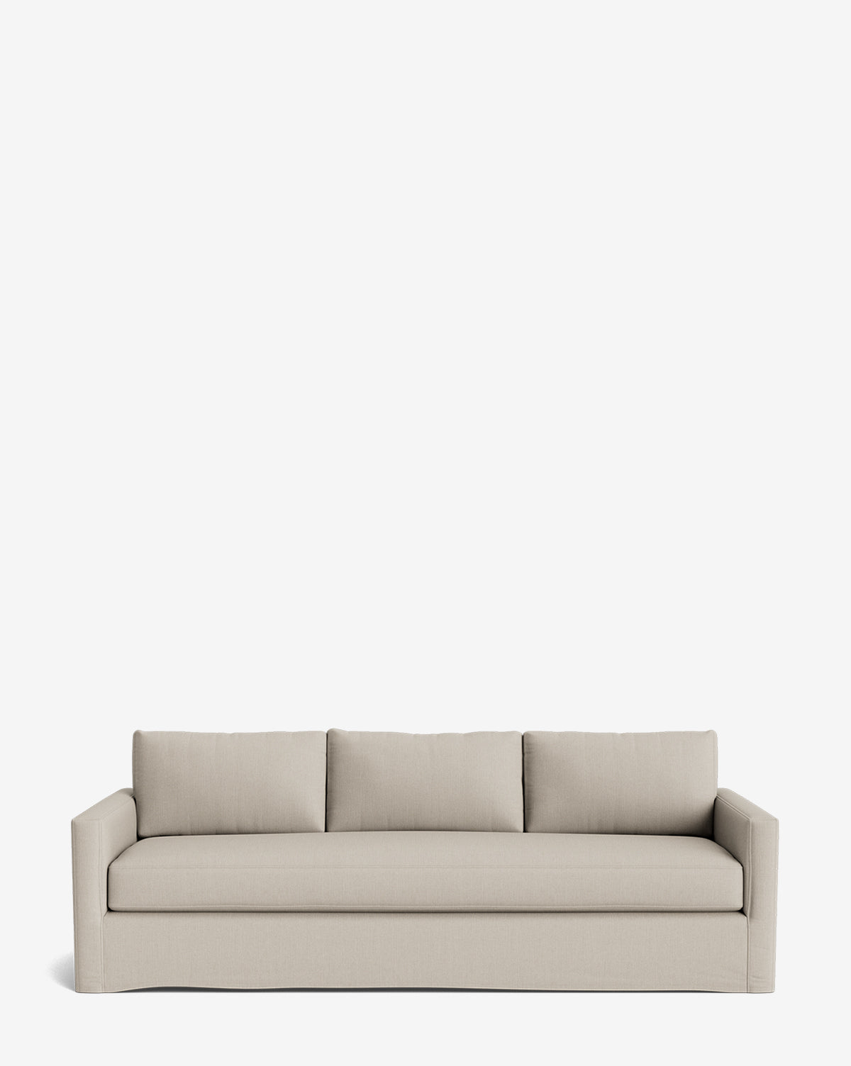 The Macy Slipcover Sofa (84-96) is a modern, light beige upholstered sofa with deep seating, three seat cushions, three matching back pillows, wide curved arms, and a minimalist design. Shown against a plain white background by McGee & Co.