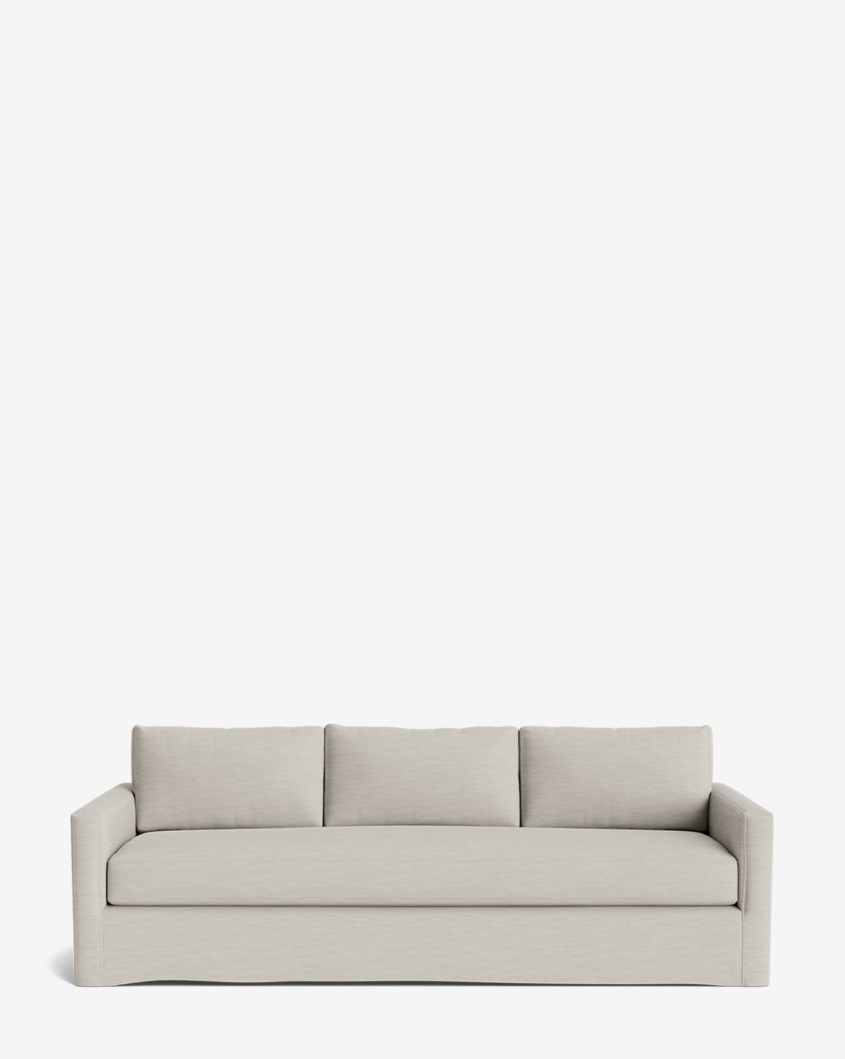 The Macy Slipcover Sofa (84-96) is a modern, light gray deep sofa with clean lines, straight arms, and three large back cushions, shown against a plain white background by McGee & Co.