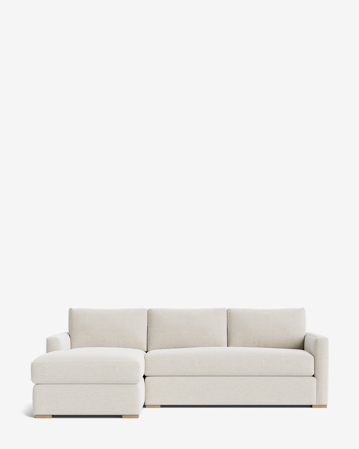 The Macy Upholstered Chaise Sectional 101 by Community is a modern, luxury light beige sofa with a left-facing chaise, low wooden legs, and plush cushions, shown against a plain white background. McGee & Co.